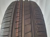 the tire of a car is shown on a cloudy day