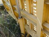 a close up picture of a yellow train car