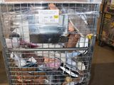 a metal cart with a lot of food inside of it