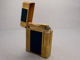 a lighter that is made out of wood and has a black cover