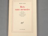 an image of a book with a pink border on a gray surface