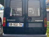 a black van that is parked on the side of the road