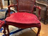 a red chair that is sitting in a room