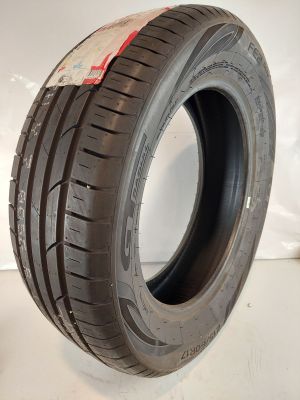 a close up of a tire on a white surface