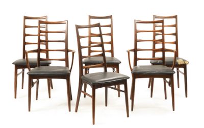set of four dining chairs with black leather upholstered seats