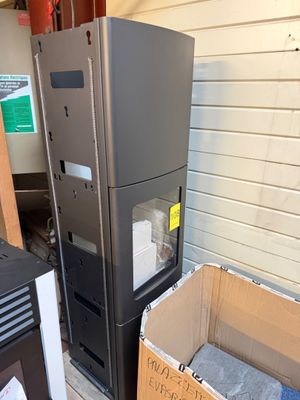 a refrigerator and a refrigerator freezer in a garage