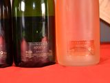 three bottles of wine sitting next to each other on a table