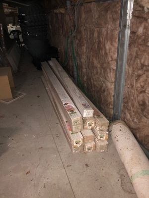 several pieces of wood are stacked on top of each other in a room