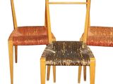three chairs that are sitting next to each other