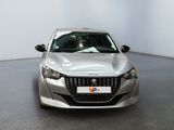 the front view of a silver car parked in a white room