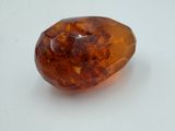 an image of a piece of amber on a white surface