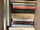 a box full of books that are sitting on top of each other