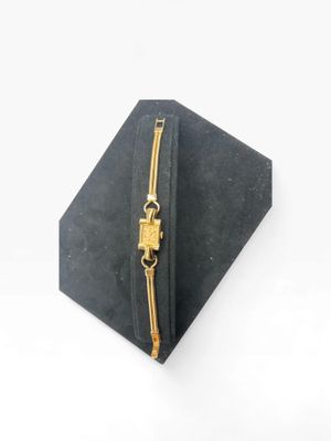 a close up of a black box with a gold zipper