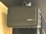a speaker that is sitting on top of a box