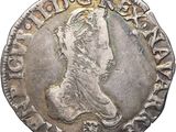 a silver coin with a portrait of a man on it