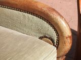 a close up of a chair with a cushion on it