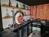 a bar with a lot of liquor bottles on the shelves