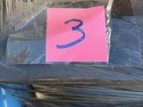 a pink sticker that says 3 on the side of a motorcycle