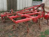 an image of a tractor plow in a field