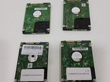 three hard drives sitting on top of each other on top of a table
