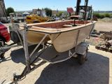 a small boat that is sitting on a trailer