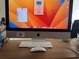 a computer monitor sitting on a desk with a mouse