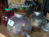 many jars on a table with jars on top of it