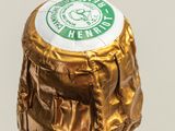 a bottle of wine with a gold wrapper on it
