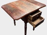 a wooden table with two drawers underneath it