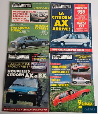four magazines of different cars on display on a white surface