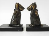 pair of bronze dog bookends on black marble bases