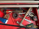 a red tool box filled with various tools and tools