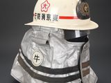 a white helmet with a red star on it