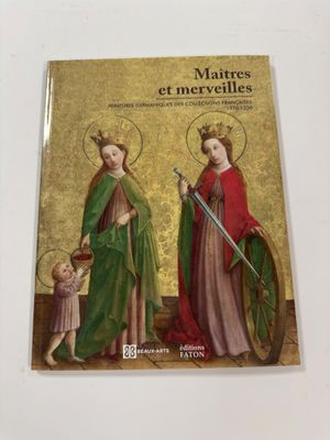 un livre sur lequel figurent deux femmes et un enfant