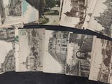 many old photographs of a city on a table