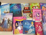 several children ' s books are lined up on a table