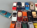 a lot of toy cars that are sitting on a table