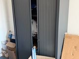 a cardboard box in the middle of a room filled with boxes