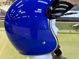 a blue helmet sitting on top of a green table