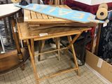 a table with a surfboard on top of it in a room