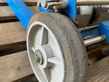 a close up of a dolly on a wooden pallet