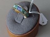 a ring that is sitting on top of a ring box