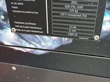 a close up of a television with a remote on it