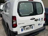 a white van that is parked in a parking lot