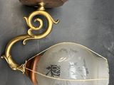 a light that is hanging on the wall next to a lamp