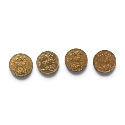 four gold coins are arranged in a row on a white surface