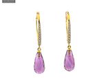 a pair of earrings with amethorate and diamonds on a white background