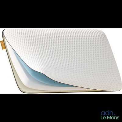 a close up of a pillow on a white surface