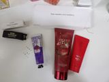 a white counter top with various beauty products on it