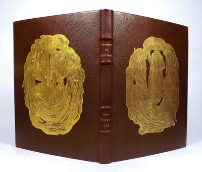 an old book with a gold plated design on the cover